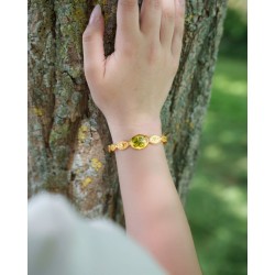 Bracelet jonc « Soleils » en acier inoxydable 304 doré et son trèfle en cabochon