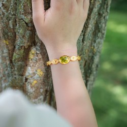 Bracelet jonc « Soleils » en acier inoxydable 304 doré et son trèfle en cabochon